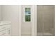Clean bathroom with a shower and a window for natural light at 1565 Goldfinch Perch Ln, Knightdale, NC 27545