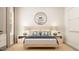 Relaxing bedroom with a light wood bed frame and neutral decor at 1565 Goldfinch Perch Ln, Knightdale, NC 27545