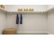 Walk-in closet with shelving and hanging rods at 1565 Goldfinch Perch Ln, Knightdale, NC 27545