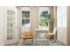 Bright home office with two chairs and a large window at 1565 Goldfinch Perch Ln, Knightdale, NC 27545