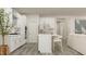 Bright eat-in kitchen features white shaker cabinets and stainless steel appliances at 1565 Goldfinch Perch Ln, Knightdale, NC 27545