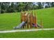 Wooden playset with two slides at 1565 Goldfinch Perch Ln, Knightdale, NC 27545