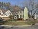 Two-story home with landscaped yard, stone accents, and a mature tree at 1700 Southern Hills Ct, Raleigh, NC 27604