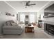 Cozy living room with neutral decor, fireplace, and decorative shelving at 1700 Southern Hills Ct, Raleigh, NC 27604