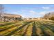 Expansive backyard view highlighting the house, and the screened-in porch at 182 River Ridge Ln, Timberlake, NC 27583