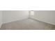 Well-lit bedroom with neutral walls and carpet at 192 Paper Birch Way, Fuquay Varina, NC 27526