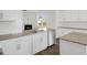 Spacious kitchen boasts granite countertops and white cabinets at 192 Paper Birch Way, Fuquay Varina, NC 27526