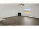 Living room features hardwood floors, fireplace and ceiling fan at 192 Paper Birch Way, Fuquay Varina, NC 27526