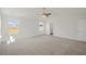 Main bedroom with high ceiling, carpet, and en-suite bathroom at 192 Paper Birch Way, Fuquay Varina, NC 27526