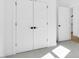 Spacious bedroom closet with double doors and neutral color palette at 203 Royal St, Fuquay Varina, NC 27526