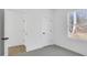 Bright bedroom with wood-look floors and an adjacent closet at 203 Royal St, Fuquay Varina, NC 27526