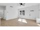 Bright living room with hardwood floors and access to kitchen at 203 Royal St, Fuquay Varina, NC 27526