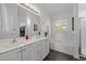 Double vanity bathroom with soaking tub and window for natural light at 203 Stoney Dr, Durham, NC 27703