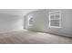 Bedroom featuring neutral carpet, two windows, and neutral paint at 209 Meadowbark Bnd # 20, Garner, NC 27529