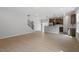 Bright, open living area with wood floors and a modern kitchen, perfect for entertaining and Gathering gatherings at 209 Meadowbark Bnd # 20, Garner, NC 27529
