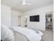 Bright bedroom with a queen-size bed and ensuite bathroom access at 24 Barn Owl Ln, Pittsboro, NC 27312