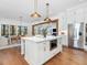 Open concept kitchen with island and stainless steel appliances at 24 Barn Owl Ln, Pittsboro, NC 27312