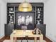 Stylish home office with dark built-ins and a light wood desk at 24 Barn Owl Ln, Pittsboro, NC 27312