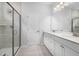 Bathroom with double vanity, white cabinets, and a large shower at 2908 Huxley Way, Apex, NC 27502