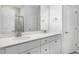 Double vanity bathroom with white cabinets and quartz countertop at 2908 Huxley Way, Apex, NC 27502