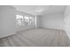 Bright bedroom with carpeted floor and large windows at 2908 Huxley Way, Apex, NC 27502