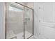 Large walk-in shower with glass enclosure and tiled walls at 2908 Huxley Way, Apex, NC 27502