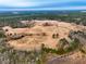 Aerial view of property with a large field, woods, and a creek at 330 Ellis Stewart Ln Ln, Cameron, NC 28326