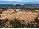 Aerial view showing large lot with home and surrounding woods at 330 Ellis Stewart Ln Ln, Cameron, NC 28326