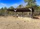 Rustic wooden shelter with concrete base in a rural setting at 330 Ellis Stewart Ln Ln, Cameron, NC 28326