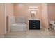 Bathroom with soaking tub, dark vanity, and tile flooring at 330 Ellis Stewart Ln Ln, Cameron, NC 28326