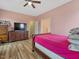 Spacious bedroom with hardwood floors, large TV and ample closet space at 330 Ellis Stewart Ln Ln, Cameron, NC 28326