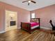 Comfortable bedroom with hardwood floors, a sleigh bed, and ensuite bathroom access at 330 Ellis Stewart Ln Ln, Cameron, NC 28326