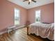 Bedroom with two windows, hardwood floors, and a bed at 330 Ellis Stewart Ln Ln, Cameron, NC 28326