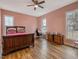 Bright bedroom with hardwood floors, a wooden sleigh bed, and plenty of natural light at 330 Ellis Stewart Ln Ln, Cameron, NC 28326