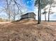 Rustic home exterior on a hill with mature trees at 330 Ellis Stewart Ln Ln, Cameron, NC 28326