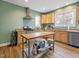 Bright kitchen with light wood cabinets, granite countertops and stainless steel appliances at 330 Ellis Stewart Ln Ln, Cameron, NC 28326