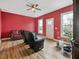 Relaxing living room featuring red walls, hardwood floors, and comfortable seating at 330 Ellis Stewart Ln Ln, Cameron, NC 28326