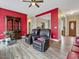 Spacious living area with hardwood floors, red accent walls and ample natural light at 330 Ellis Stewart Ln Ln, Cameron, NC 28326