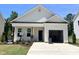 Charming single-story home with a one-car garage, quaint porch, and fresh landscaping at 356 Maidenhair Pl, Clayton, NC 27520