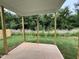 Covered patio perfect for outdoor relaxation and entertaining, surrounded by a lush, green yard at 356 Maidenhair Pl, Clayton, NC 27520