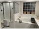 Elegant bathroom featuring a soaking tub, modern fixtures, and stylish tile work, creating a spa-like experience at 359 Ballast Pt, Clayton, NC 27520