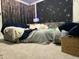 Cozy bedroom featuring a comfortable couch and decorative starry tapestry at 359 Ballast Pt, Clayton, NC 27520