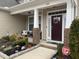 Inviting front porch with seating, brick accents, and a charming, welcoming entrance at 359 Ballast Pt, Clayton, NC 27520