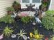 Charming front porch featuring decorative landscaping, a seating area, and attractive outdoor decor at 359 Ballast Pt, Clayton, NC 27520