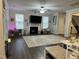 Spacious living room with a fireplace, large rug, and ample natural light at 359 Ballast Pt, Clayton, NC 27520