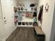 Functional mudroom with built-in storage, hooks, and bench seating, offering an organized and welcoming entryway at 359 Ballast Pt, Clayton, NC 27520