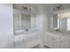 Double vanity bathroom featuring matching mirrors and bright cabinets for added convenience at 3854 Well Fleet Drive, Fuquay Varina, NC 27526