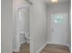 Inviting foyer with hardwood flooring and a convenient powder room located just off the entrance at 3854 Well Fleet Drive, Fuquay Varina, NC 27526
