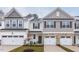 Charming townhome with stone accents, attached garages, and inviting curb appeal, a great place to call home at 3854 Well Fleet Drive, Fuquay Varina, NC 27526