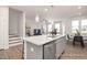 Open kitchen with stainless appliances, granite island with breakfast bar perfect for casual dining at 3854 Well Fleet Drive, Fuquay Varina, NC 27526